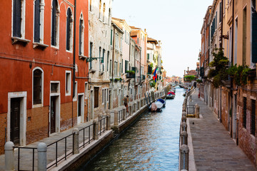 Fototapeta na wymiar Narrow canals are famous and typical in Venice.