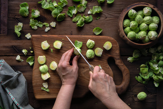 Woman chopping brussel sprouts