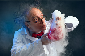 Crazy chemist smelling his experiment - obrazy, fototapety, plakaty