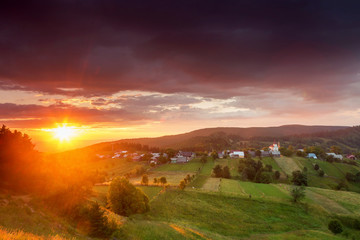 Fototapeta na wymiar Summer sunrise in Bucovina, Romania