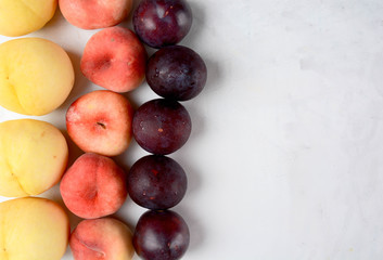 Beautiful sweet peaches and plums.
