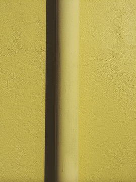 Detail of gutter pipe on building wall, close up
