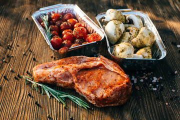 Raw meat with mushrooms and tomatoes before cooking