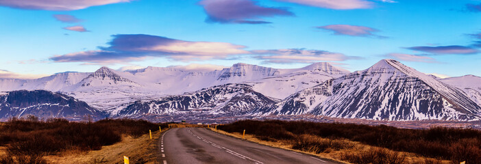 Typical Iceland landscape with road and mountains.