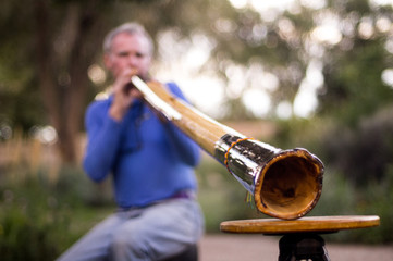 Man Playing Didgeridoo with Shallow Depth-of-Field