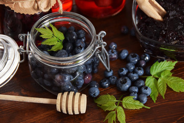 blueberries and raspberries in jars for the winter tea