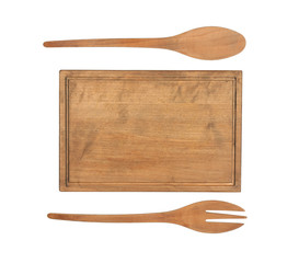 Wooden board and utensils on white background