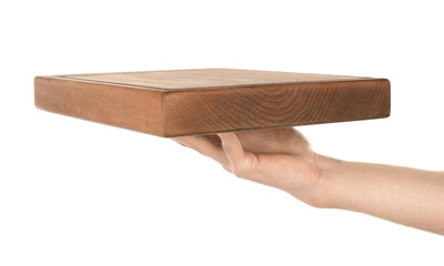 Female hand holding wooden board on white background