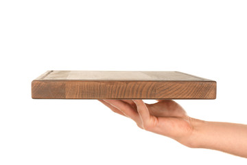 Female hand holding wooden board on white background © Africa Studio