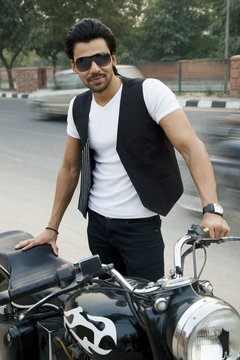 Man posing with his motorcycle 