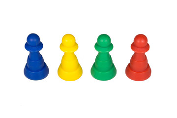 Plastic board game pieces, figures, pawns, puppets isolated on white background.