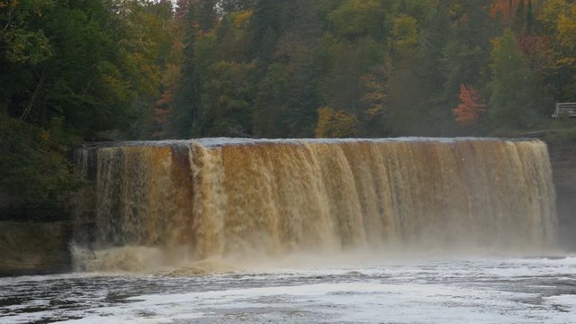 Panning right on Upper Tahquamenon Falls in Autumn, in the Upper Peninsula of Michigan; includes ambient audio.