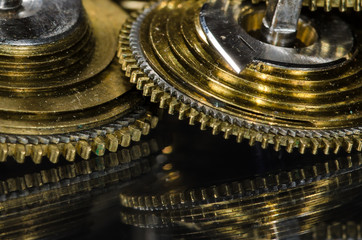 Watch Repair: Vintage Pocket Watch Fusee Cone Resting on a Black Surface
