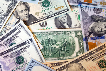 Dollars of different denominations close-up.