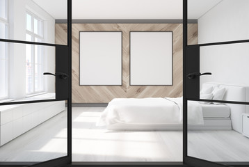 Wooden bedroom, two posters, door