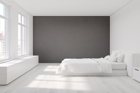 White bedroom with a gray wall