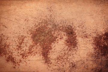 Rusty worn sheet of metal in orange color