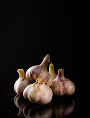 Fresh Garlic. Garlic bulbs on a black background