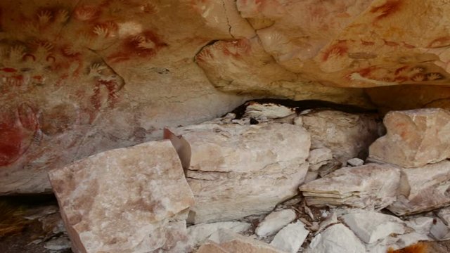 Cave paintings in Cave of hands or Cueva de las Manos in valley of Pinturas River. Patagonia, Argentina
