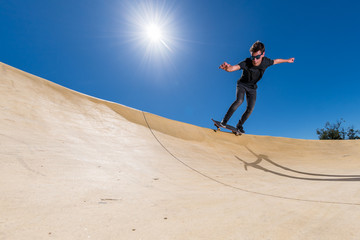 Skateboarder on a pump track park