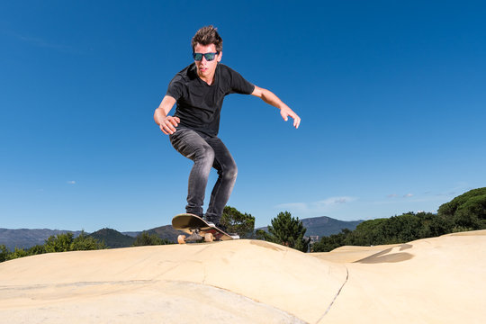 Skateboarder on a pump track park