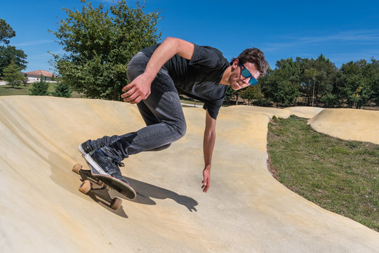 Skateboarder On A Pump Track Park