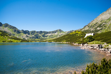 Fototapeta na wymiar Valley of five Ponds. Mountains mountain lake tatry and mountain shelter.