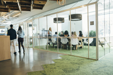 Group of people having a business meeting in modern office space