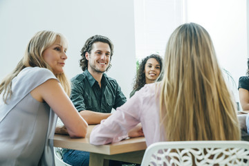Group of people having a business meeting in modern office space