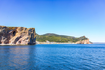Fototapeta na wymiar Panorama cityscape of Perce in Gaspe Peninsula, Quebec, Gaspesie region with cliffs in morning and Rocher Perce side view