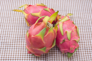 dragon fruit in basket on table