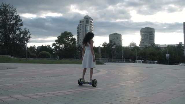 Anonymous woman riding gyroscooter