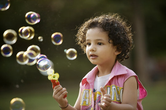 Boy playing with bubbles 