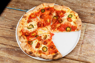 Artichoke pizza on a metal shovel