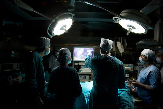 Surgeon looking at an operating screen 