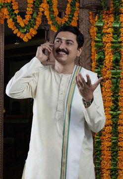 South Indian man talking on a mobile phone 