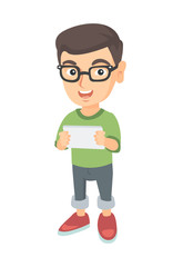 Little caucasian boy using a tablet computer. Smiling boy holding digital tablet in hands. Happy boy playing with digital tablet. Vector sketch cartoon illustration isolated on white background.