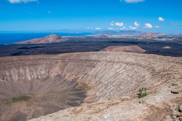 Fototapeta na wymiar Non - active volcanic crater and ancient basalitc lava flows, Lanzarote, Canary Islands