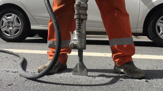 Building demolition jack hammer drill breaking concrete