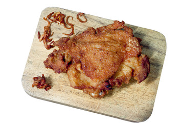 Delicious fried chicken with Fried garlic on the wood and white background.