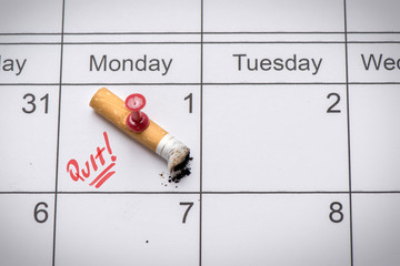 Cigarette on calendar. Time to quit smoking concept