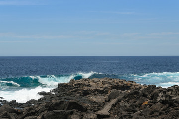 Fototapeta na wymiar Oceanic waves against the Boca de Abaco volcanic rocks coast, Lanzarote, Canary Island