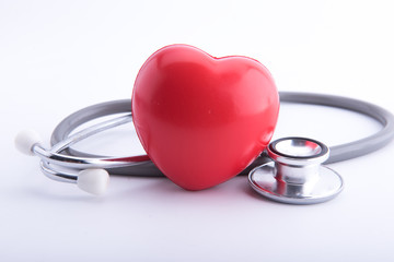 Red heart and a stethoscope isolated on white background