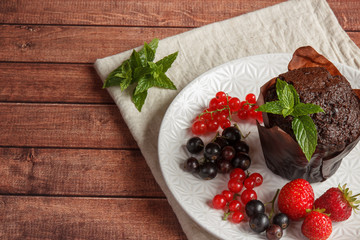 Chocolate cupcakes with summer berries.