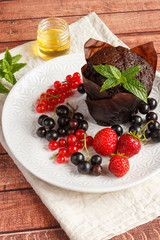 Chocolate cupcakes with summer berries.