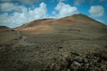 Tilt shift effect of road at the foot of ancient volcano, Lanzarote, Canary Island
