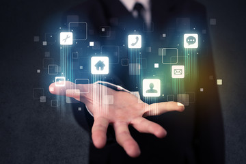 Fototapeta premium Businessman holding blue applications
