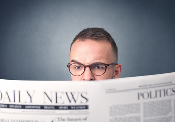 Businessman reading newspaper