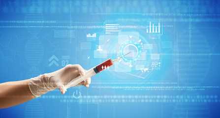 Female doctor holding syringe