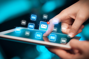 Fingers touching tablet with mail